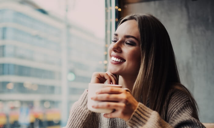 Woman sharing flawless smile after cosmetic dentistry