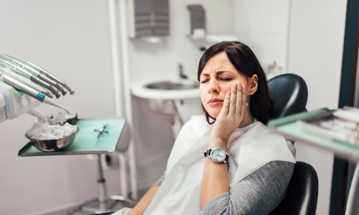 Woman in pain before emergency dentistry