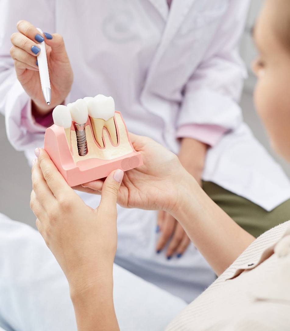 closeup of person smiling with dental implant