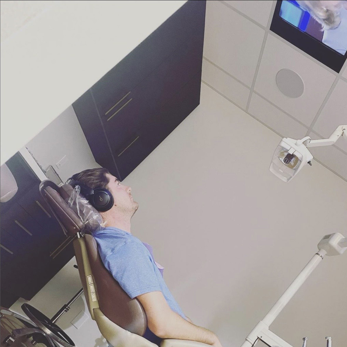 Dental patient relaxing in dental chair