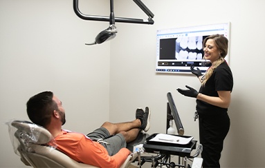 Royal Palm Beach dentist talking to dental patient