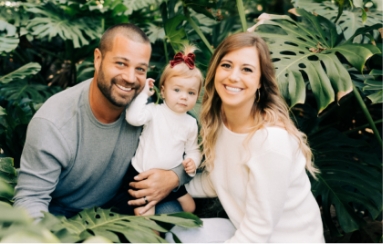 Doctor Civetti and her family smiling outdoors