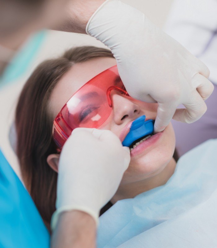 Dental patient receiving fluoride treatment