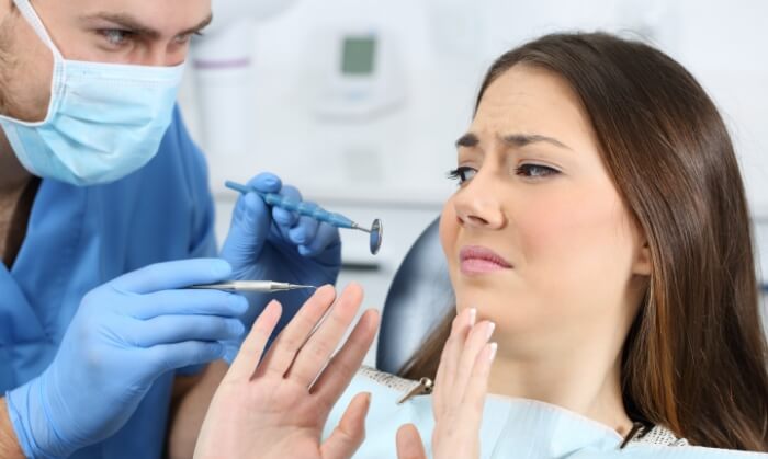 Fearful dental patient in need of a visit to her sedation dentist