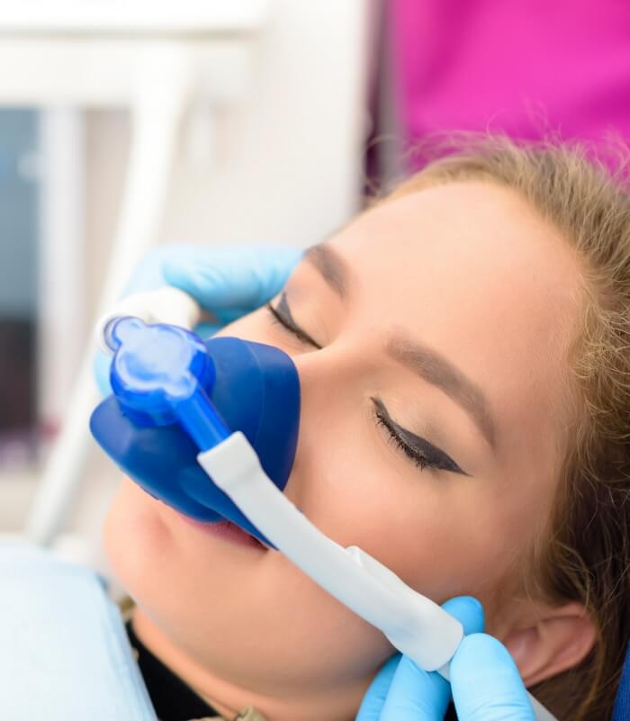 Relaxed dentistry patient receiving nitrous oxide dental sedation