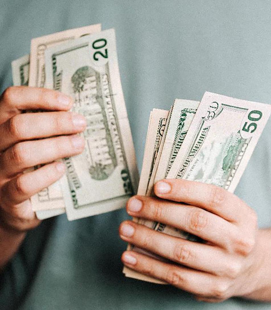 Man’s hands counting cash