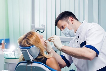 Dentist performing treatment on patient