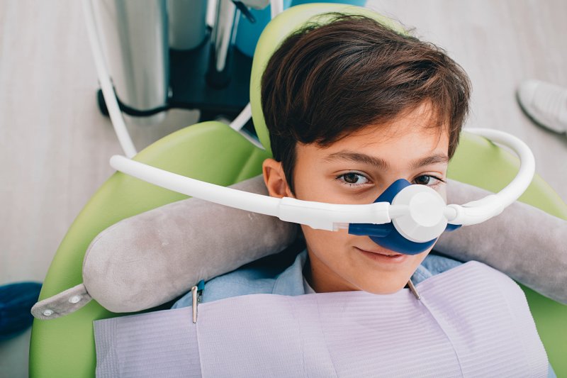 A young boy receiving nitrous oxide sedation