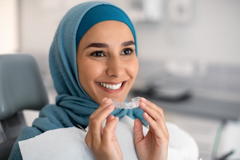 Patient about to put in their Invisalign tray