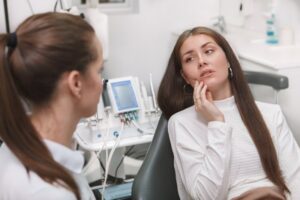 Woman at her dentist for her dental emergency